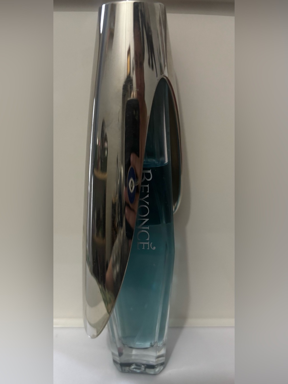 Beyoncé Aqua Glass Accent Vase with Metallic Silver Overlay.
75 ml over 100 ml